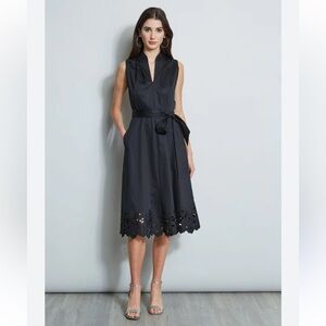 Elie Tahari A-Line dress in black with a V-neck, belt, and scalloped hem